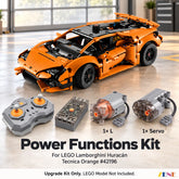 Front three-quarter view of an orange LEGO Huracán with one remote, one battery, one L motor and one servo in a modern garage.